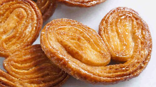 Avec quelle pâte le pâtissier réalise-t-il ses palmiers ? 