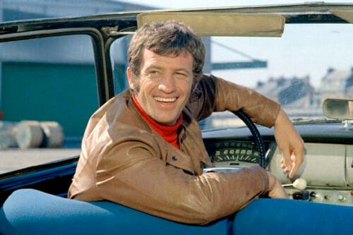 Quel acteur comique accompagne Jean-Paul Belmondo dans le film Le cerveau ? 